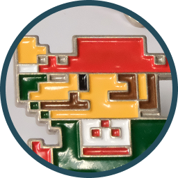 Pixel-style multicolor enamel pin shaped like retro character